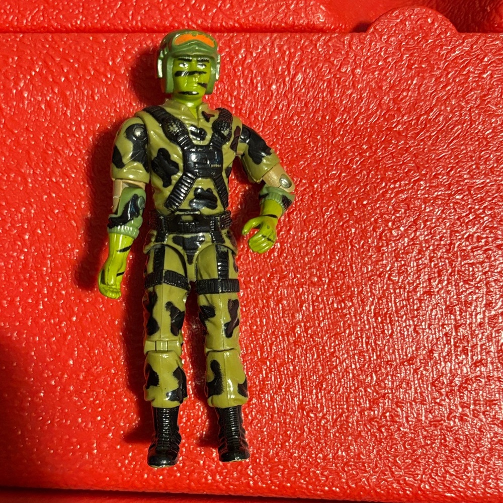 Green and Black Camouflage Action Figure